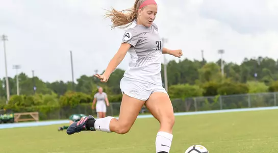 Vanessa Piermont kicks a ball towards the goal
