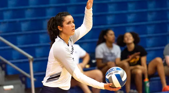 Miriam sets up for a serve