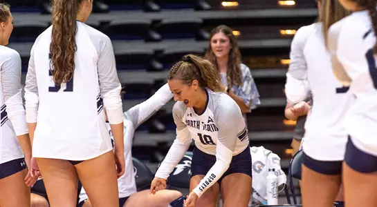 Alessia is welcomed on to the court by her teammates