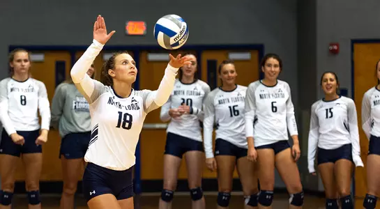 Alessia serves the ball