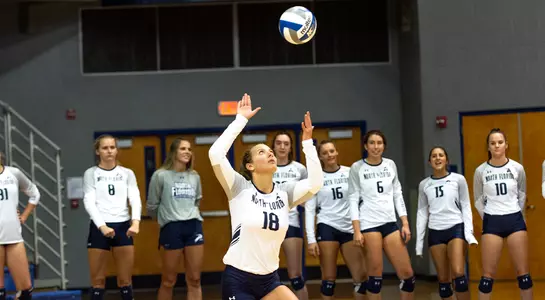 Alessia serves the ball