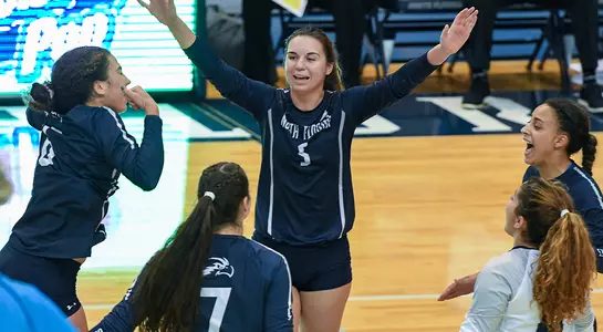 Five Ospreys celebrate during the match against Belmont.