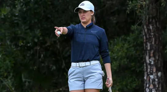 Daniela Gonzalez lines up a putt on the green