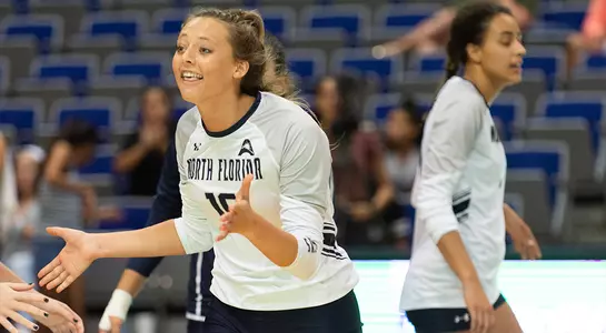 Maddie talking to her teammates