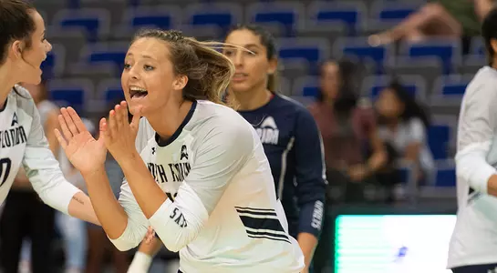 Maddie talking to her teammates