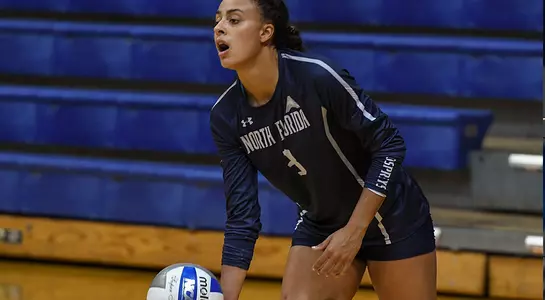 Gabby sets up to serve