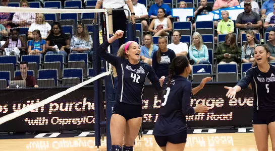 Taryn (left) celebrates with the team
