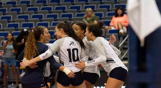 The team huddles up after a point