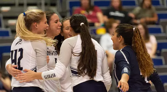 The team huddles up after a point