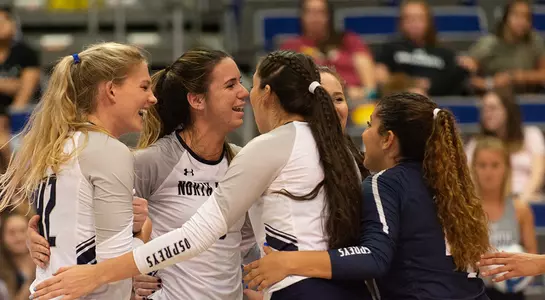 the team huddles up after a point