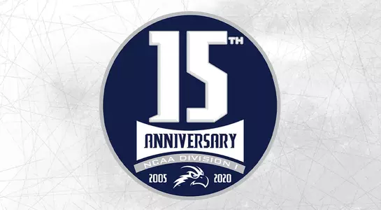 Grey scratches background behind 15th anniversary emblem.