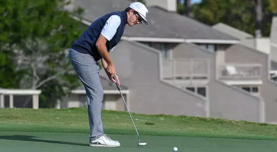 Cody Carroll makes a putt on the green