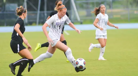 Emma Voigt dribbles the soccer ball