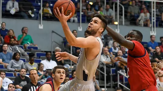Ivan Gandia-Rosa makes a layup over a defender