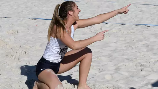 Carolyn Cain points after winning a point.