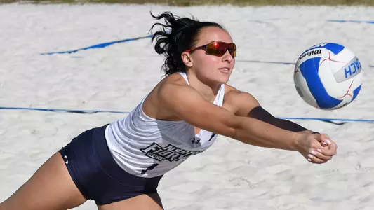 Dana Roskic dives after the volleyball.
