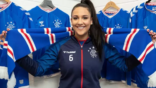 Former Osprey women's soccer player Sonia ONeill poses in her new uniform after signing to play with Scotland's Rangers FC