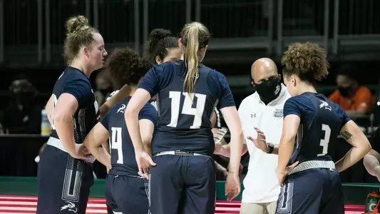 Women's basketball huddles at Miami