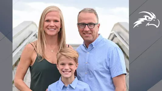 Mark Cagnassola poses on beach with wife Micah and son Hank