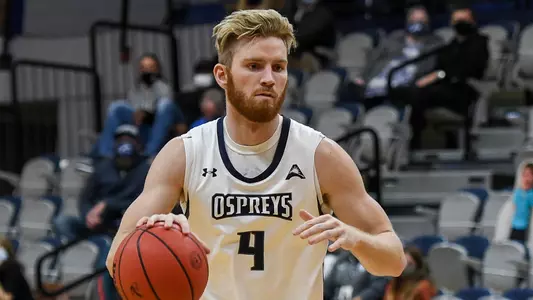 Josh Endicott dribbles a basketball