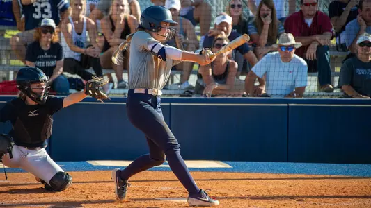 Taylor Engman swings the softball bat during a fall game.