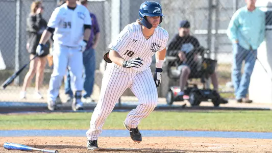 Tanner Clark sprints to first base