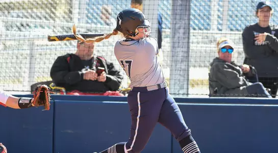 action shot of rebecca koskey swinging
