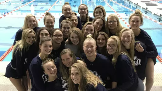 Swimming team poses before the last day of the CCSA Championship.
