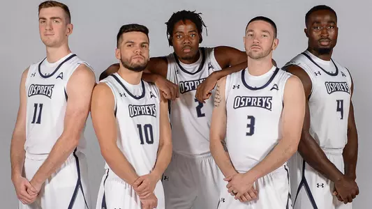 2020 senior class for North Florida men's basketball poses as a group