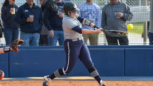 Rebecca Koskey swings the softball bat at UNF Softball Complex.