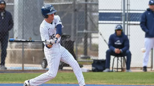 Cade Reich swings the bat.