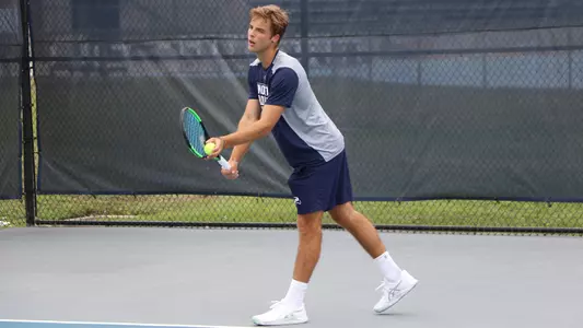 NIlo Duarte about to toss a serve toss to himself.