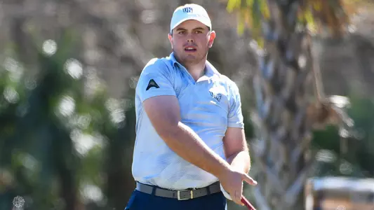 Michael Mattiace watches the flight of his golf ball from the tee box