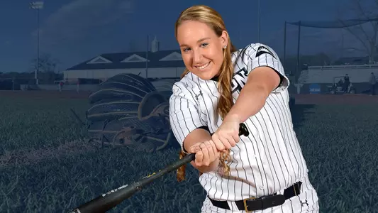 Rebecca Koskey on the background of softball gloves at the field.