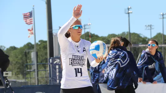 Carleigh Semeniuk holds up for a serve.