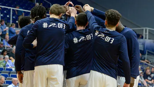 North Florida men's basketball team huddles at midcourt