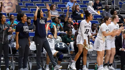 women's basketball celebrates at the arena.
