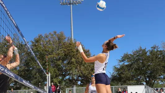 Antonia Harrison jumps to hit the ball.