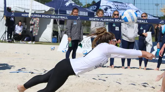 Carolyn Cain dives after a ball.