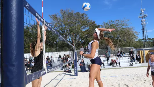 Madilyn McCarty rears back to hit the ball.
