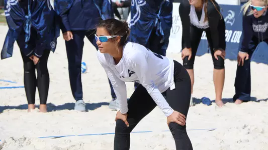 Marisa Rogers awaits a serve.