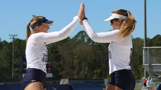 Callie Workman and Madilyn McCarty high five
