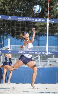 Marisa Rogers sends the ball over the net.