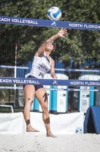 Marisa Rogers hits the ball over the net.