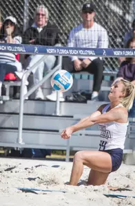 Sydni Small digs out the ball.