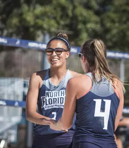 Gabby O'Connell and Carolyn Cain high five.