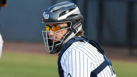 Tanner Clark looks on.