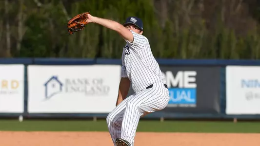 Dominick Madonna reaches back before a pitch.