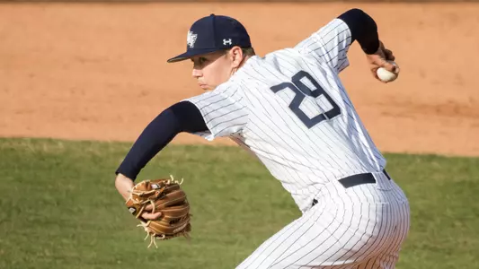 Justin Parrish rears back to deliver a pitch.