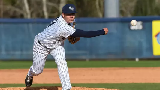 Justin Parrish spins a pitch to the plate